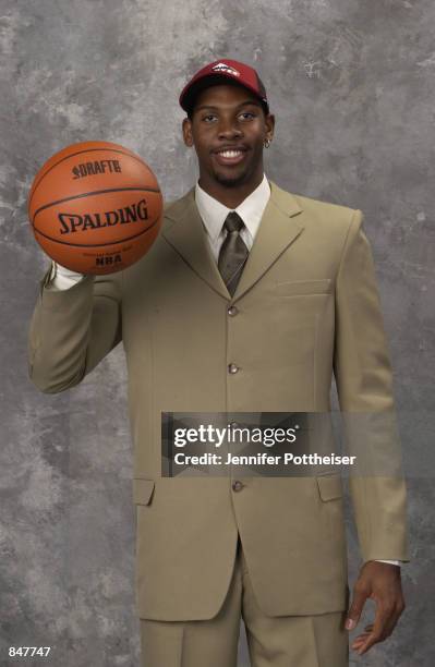 Nene Hilario poses for a portrait after being drafted by the Denver Nuggets during the 2002 NBA Draft at The Theater at Madison Square Garden on June...