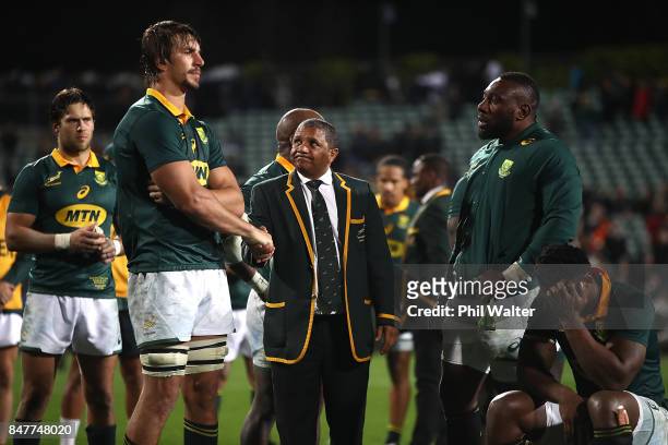 Springbok coach Alister Coetzee shakes hands with captain Eben Etzebeth following the Rugby Championship match between the New Zealand All Blacks and...