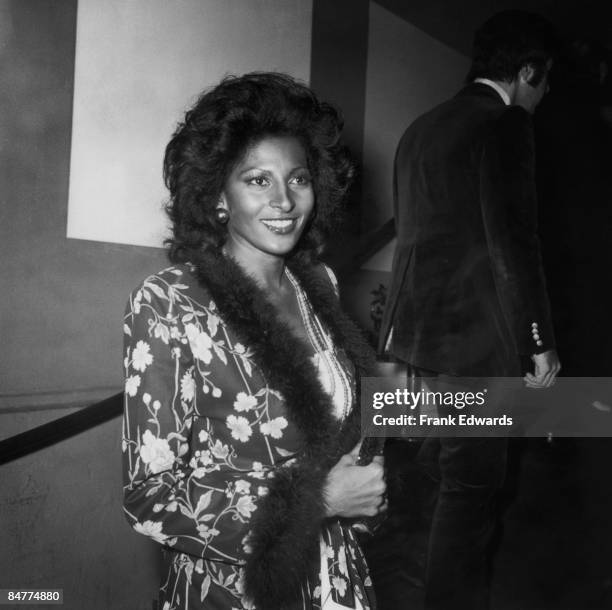 American actress Pam Grier arrives at a formal gathering, circa 1975.