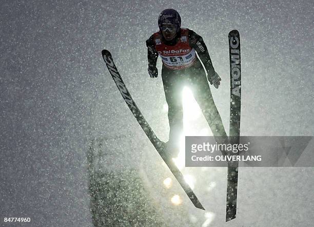 Germany's Martin Schmitt takes part in the qualifying for the FIS Ski jumping World cup in the southern German town of Oberstdorf on February 13,...
