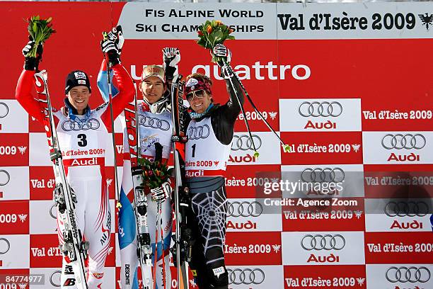 Benjamin Raich of Austria , Carlo Janka of Switzerland and Ted Ligety of the USA celebrate on the podium during the Alpine FIS Ski World...