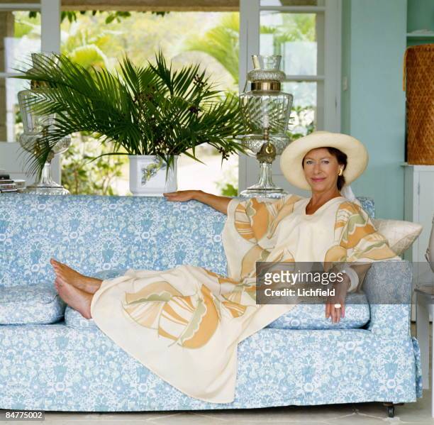 The Princess Margaret reclining on a sofa at her home, Les Jolies Eaux, on Mustique in the West Indies in April 1976. .