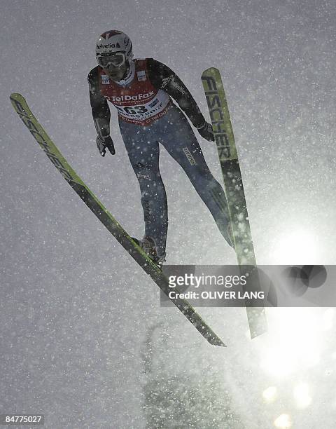 Switzerland's Simon Ammann takes part in the qualifying for the FIS Ski jumping World cup in the southern German town of Oberstdorf on February 13,...