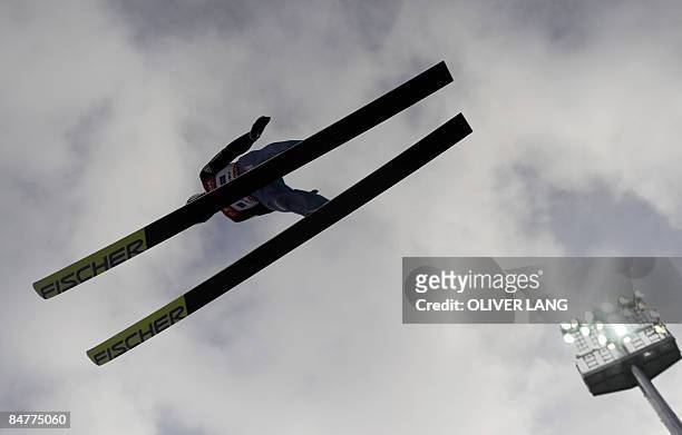 Switzerland's Simon Ammann takes part in the qualifying for the FIS Ski jumping World cup in the southern German town of Oberstdorf on February 13,...