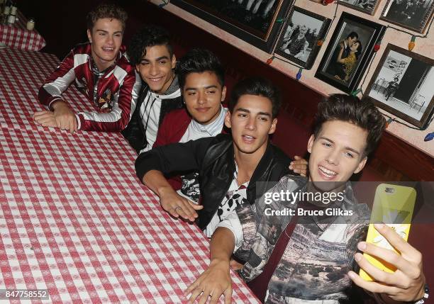 Brady Tutton, Drew Ramos, Sergio Calderon, Chance Perez and Michael Conor of "In Real Life" the grand prize winner of ABC's "Boy Band" pose for a...