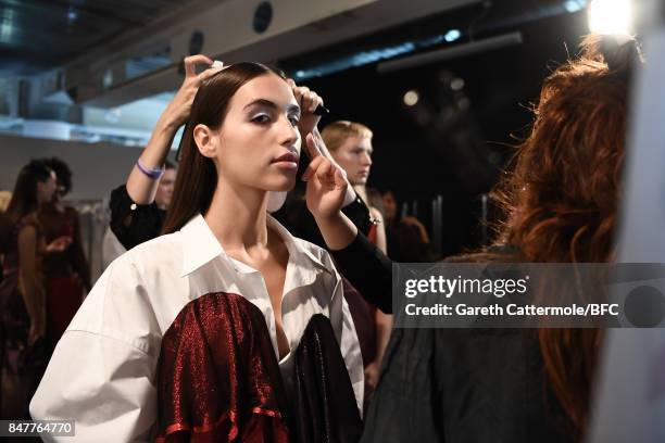 Model is seen backstage ahead of the FYODOR GOLAN show during London Fashion Week September 2017 on September 15, 2017 in London, England.