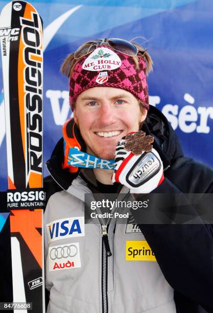 Bronze medal winner Ted Ligety of the United States of America celebrates following the Men's Giant Slalom event held on the Face de Bellevarde...