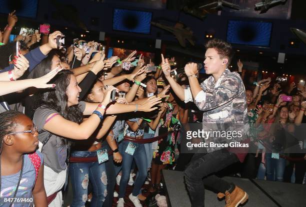 Michael Conor of the group "In Real Life" the grand prize winner of ABC's "Boy Band" performs at Planet Hollywood Times Square on September 15, 2017...