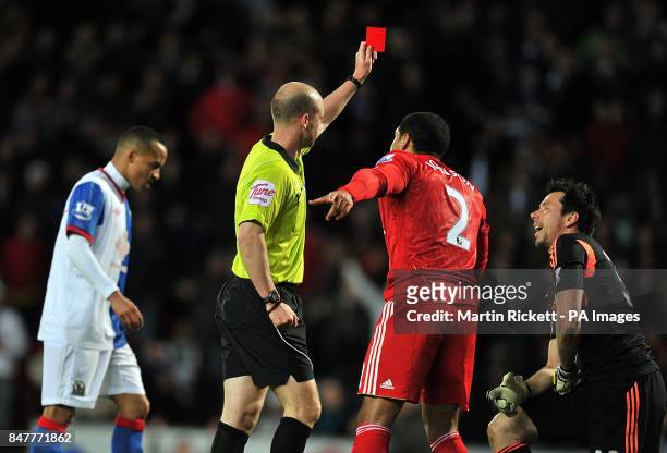 Liverpool's goalkeeper Alexander Doni is shown a red card after a foul on Blackburn Rovers' David Hoilett