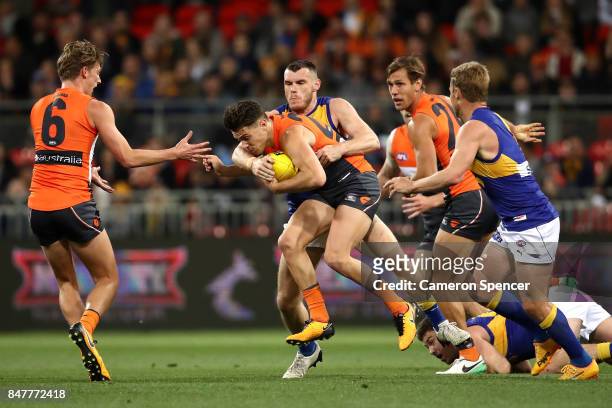 Josh Kelly of the Giants is tackled during the AFL First Semi Final match between the Greater Western Sydney Giants and the West Coast Eagles at...