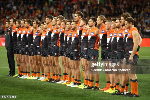 Giants players line up for the Australian national anthem during the AFL First Semi Final match between the Greater Western Sydney Giants and the...