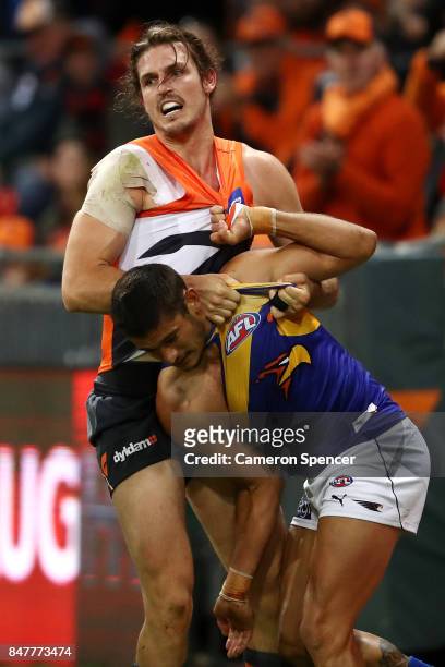 Phil Davis of the Giants wrestles with Tom Barrass of the Eagles during the AFL First Semi Final match between the Greater Western Sydney Giants and...
