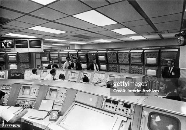 Interior view of an ACE S/C computer control room as NASA staffers run systems check for an unspecified Apollo mission, 1960s. The room is located in...