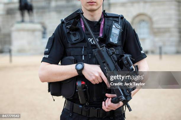 An armed police officer patrols in Horse Guards Parade on September 16, 2017 in London, England. An 18-year-old man has been arrested in Dover in...