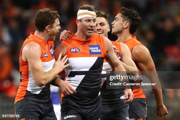 Steve Johnson of the Giants celebrates kicking a goal with team mates during the AFL First Semi Final match between the Greater Western Sydney Giants...