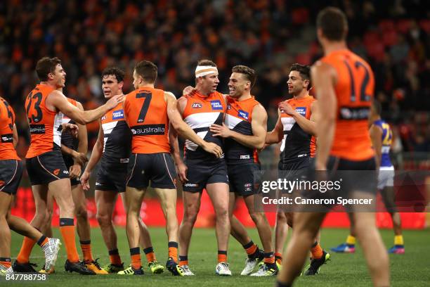 Steve Johnson of the Giants celebrates kicking a goal with team mates during the AFL First Semi Final match between the Greater Western Sydney Giants...