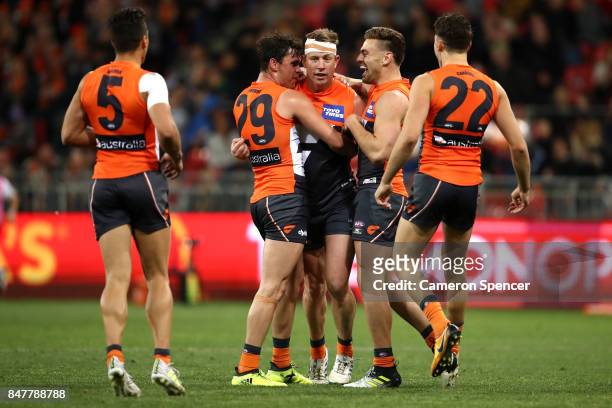 Steve Johnson of the Giants celebrates kicking a goal with team mates during the AFL First Semi Final match between the Greater Western Sydney Giants...