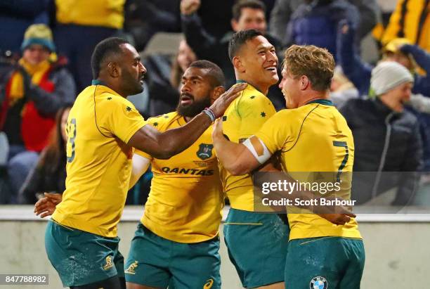 Israel Folau of the Wallabies is congratulated by Michael Hooper and his teammates after scoring a try during The Rugby Championship match between...