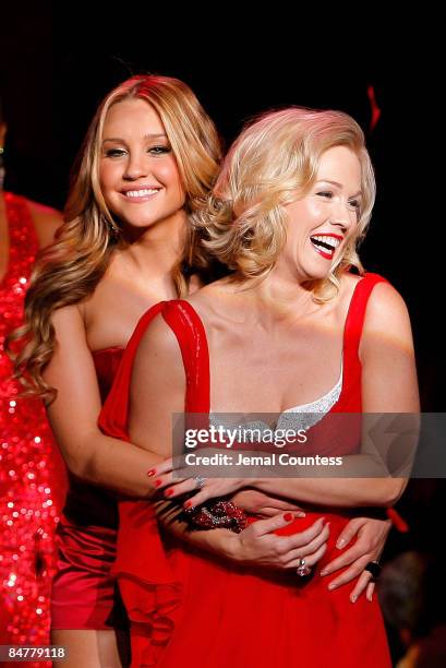 Amanda Bynes wearing Swarovski and Jennie Garth wearing Badgley Mischka share a laugh while on the runway at the Heart Truth Red Dress Collection...