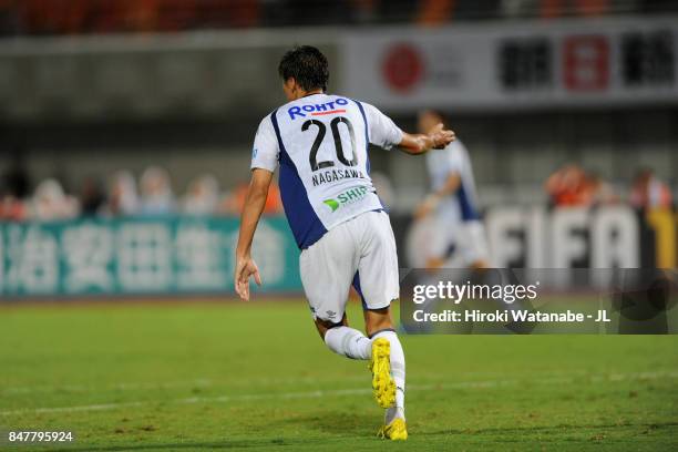 Shun Nagasawa of Gamba Osaka reacts after scoring his side's second goal during the J.League J1 match between Omiya Ardija and Gamba Osaka at...