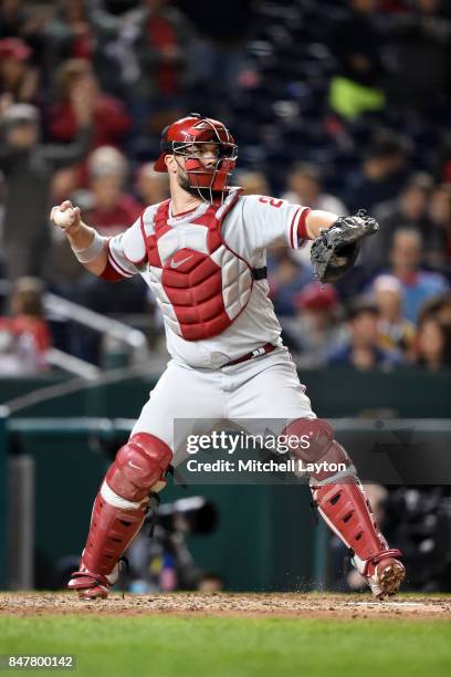 Cameron Rupp of the Philadelphia Phillies throws to second base during a baseball game against the Washington Nationals at Nationals Park on...