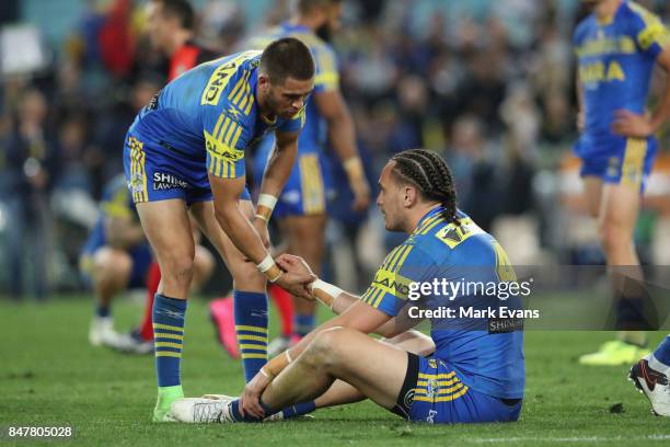 Brad Takairangi of the Eels is consoled by Will Smith after Parramatta's loss during the NRL Semi Final match between the Parramatta Eels and the...