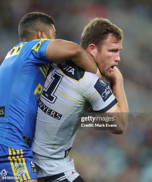 Gavin Cooper of the Cowboys tackled uring the NRL Semi Final match between the Parramatta Eels and the North Queensland Cowboys at ANZ Stadium on...