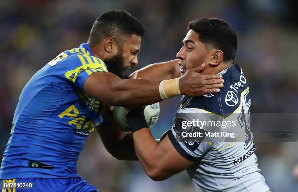 Jason Taumalolo of the Cowboys is tackled by Michael Jennings of the Eels during the NRL Semi Final match between the Parramatta Eels and the North...