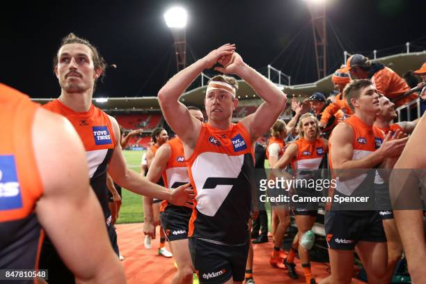 Steve Johnson of the Giants thanks fans and celebrates winning the AFL First Semi Final match between the Greater Western Sydney Giants and the West...