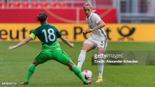 Tjasa Tibaut of Slovenia challenges Kathrin Hendrich of Germany during the 2019 FIFA women's World Championship qualifier match between Germany and...