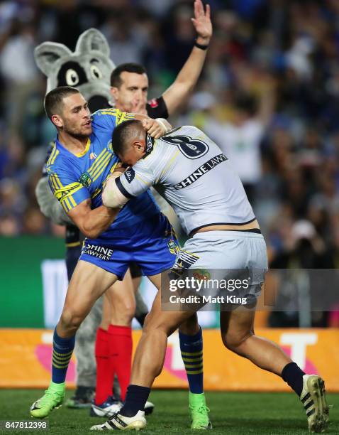 Will Smith of the Eels and John Asiata of the Cowboys wrestle after the try to Coen Hess of the Cowboys during the NRL Semi Final match between the...