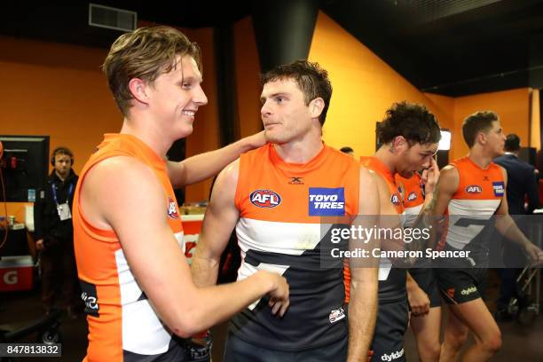 Lachie Whitfield of the Giants and Heath Shaw of the Giants embrace after winning the AFL First Semi Final match between the Greater Western Sydney...