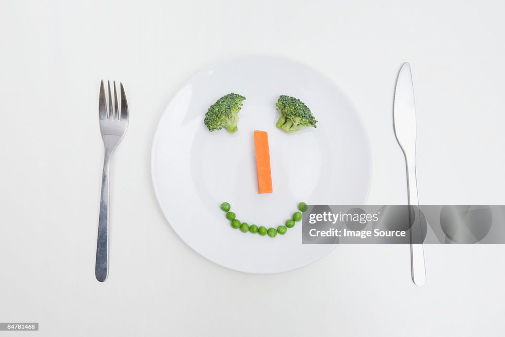 A smiley face of vegetables