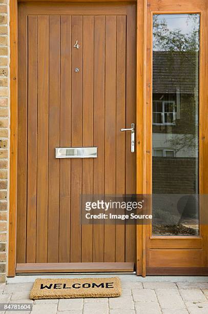 front door of house - welcome mat stock pictures, royalty-free photos & images