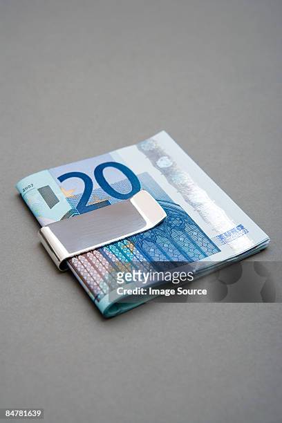 twenty euro notes in money clip - money clip stock pictures, royalty-free photos & images