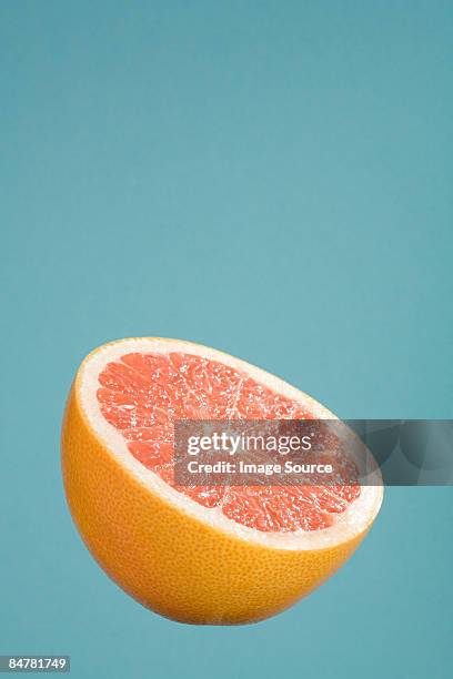 half a grapefruit - grapefruit stock pictures, royalty-free photos & images