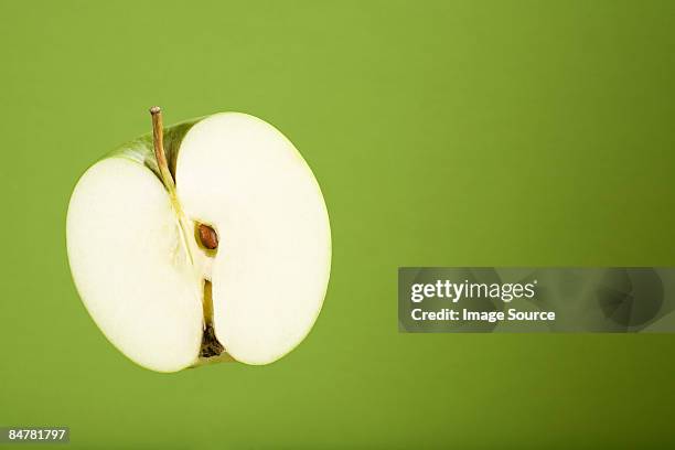 half an apple - green apple slices stock pictures, royalty-free photos & images