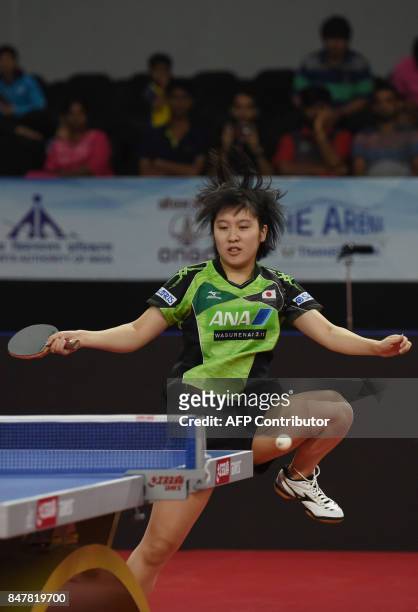 Japan's Hirano Miu plays a shot against China's Zhu Yuling in the Women's Singles semi-finals during the 30th Asian Table Tennis Cup 2017 in...