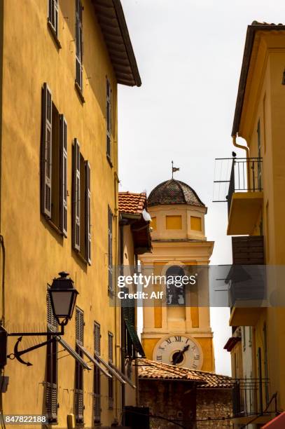 belfry of the church of st michel in  villefranche-sur-mer, french riviera, france - cannes city stock pictures, royalty-free photos & images