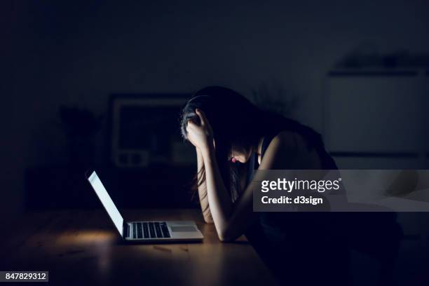stressed and frustrated businesswoman working till late at work - head in hands computer stock pictures, royalty-free photos & images
