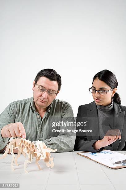 scientists with model dinosaur - palaeontologist stock pictures, royalty-free photos & images