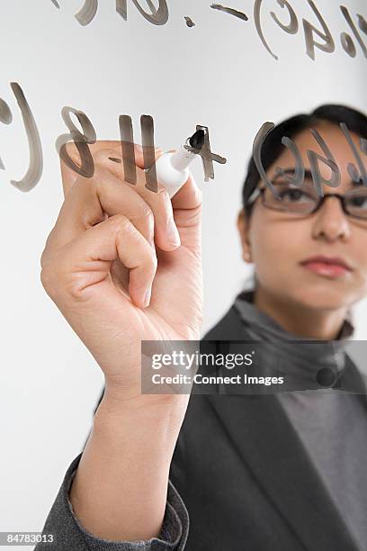 scientist writing formula - complex equation stock pictures, royalty-free photos & images