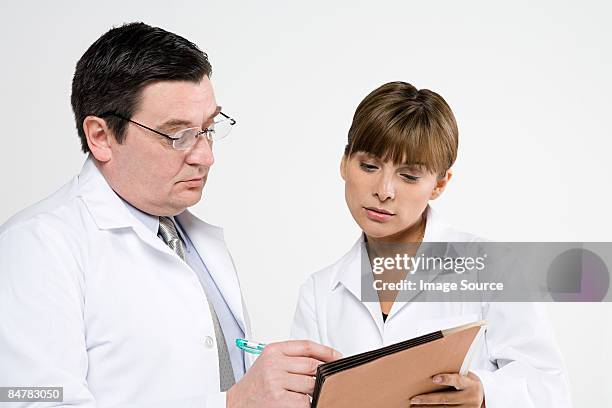 scientists with file - clipboard and glasses stock pictures, royalty-free photos & images