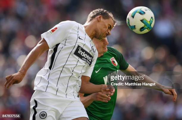 Timothy Chandler of Frankfurt jumps for a header with Martin Hinteregger of Augsburg during the Bundesliga match between Eintracht Frankfurt and FC...