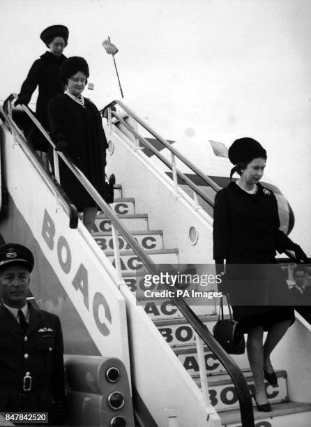 *Scanned low-res off print, high res available on request* Queen Elizabeth II, the Queen Mother and Princess Margaret leave a Comet aircraft of RAF...