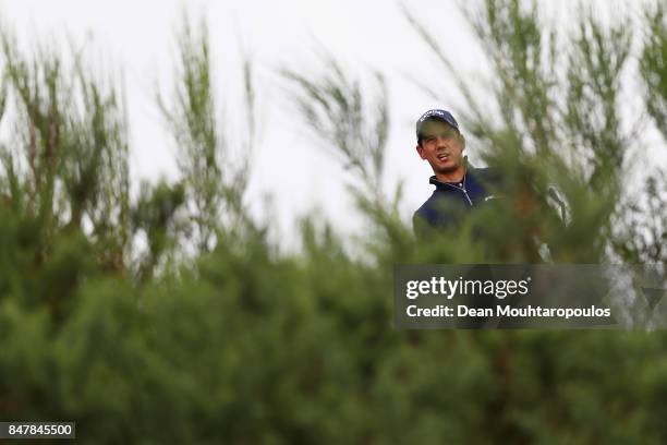 Matteo Manassero of Italy hits his third shot on the 1st hole from the bushes during day 3 of the European Tour KLM Open held at The Dutch on...