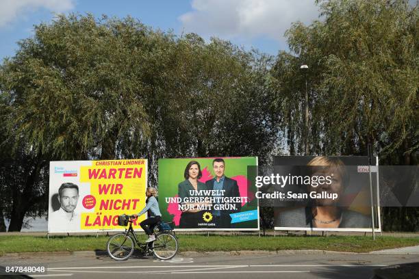 Election campaign billboards that show Christian Linder, lead-candidate of the Free Democratic Party , co-lead candidates Cem Oezdemir and Katrin...