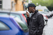 Young Male Security Guard Using Walkie-Talkie