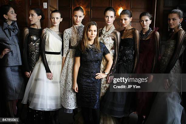 Designer Monique Lhuillier poses with models at the Monique Lhuillier presentation during Mercedes-Benz Fashion Week Fall 2009 at Oak Room on...