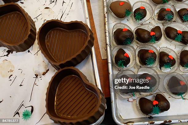 Chocolate dipped strawberries and heart shapped chocolate boxes are ready to be purchased at Schakolad Chocolate Factory on February 13, 2009 in...